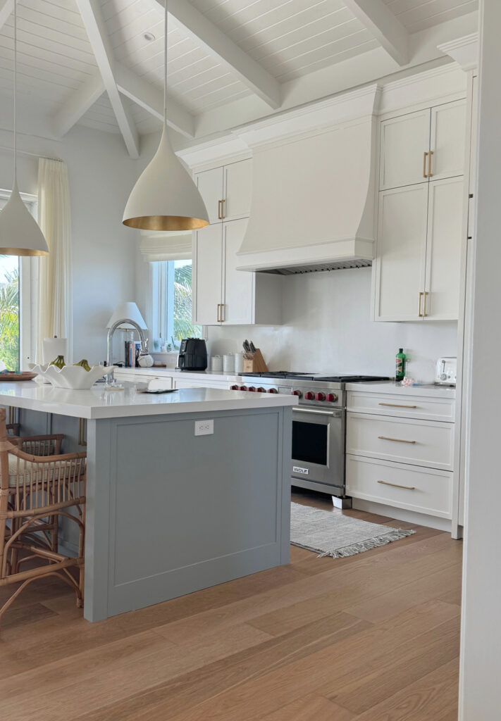 Island painted Benjamin Moore Boothbay Gray, cabinets are Sherwin Williams Snowbound, vaulted ceiling with white painted shiplap and beams, white quartz (1)