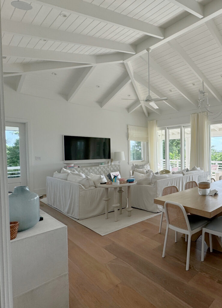 Open concept beach home, owner of LeMel jewelry, oak wood floor, walls, trims, ceiling Sherwin Williams Snowbound, beams, shiplap and vaulted ceiling
