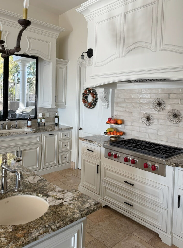 BEFORE, tuscan style kitchen, off-white painted cabinets, Dove Wing paint color on walls, granite countertop, taupe subway tile backsplash,