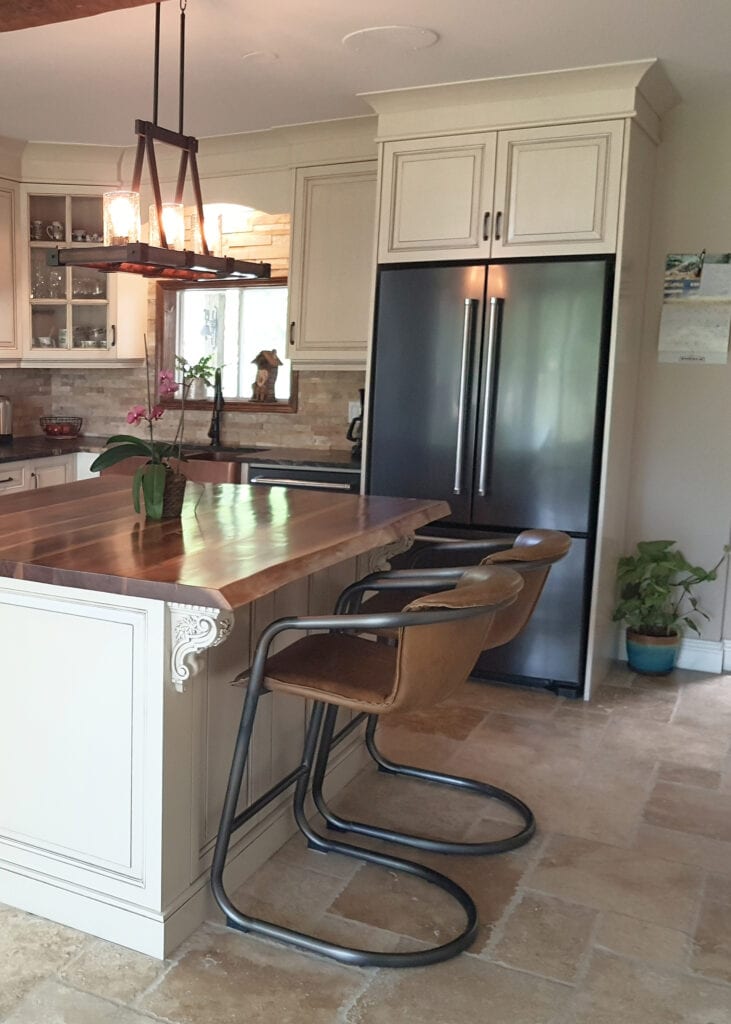 Benjamin Moore Ballet White glazed, cream painted kitchen cabinets, travertine tile floor, butcher block, live edge wood countertop,