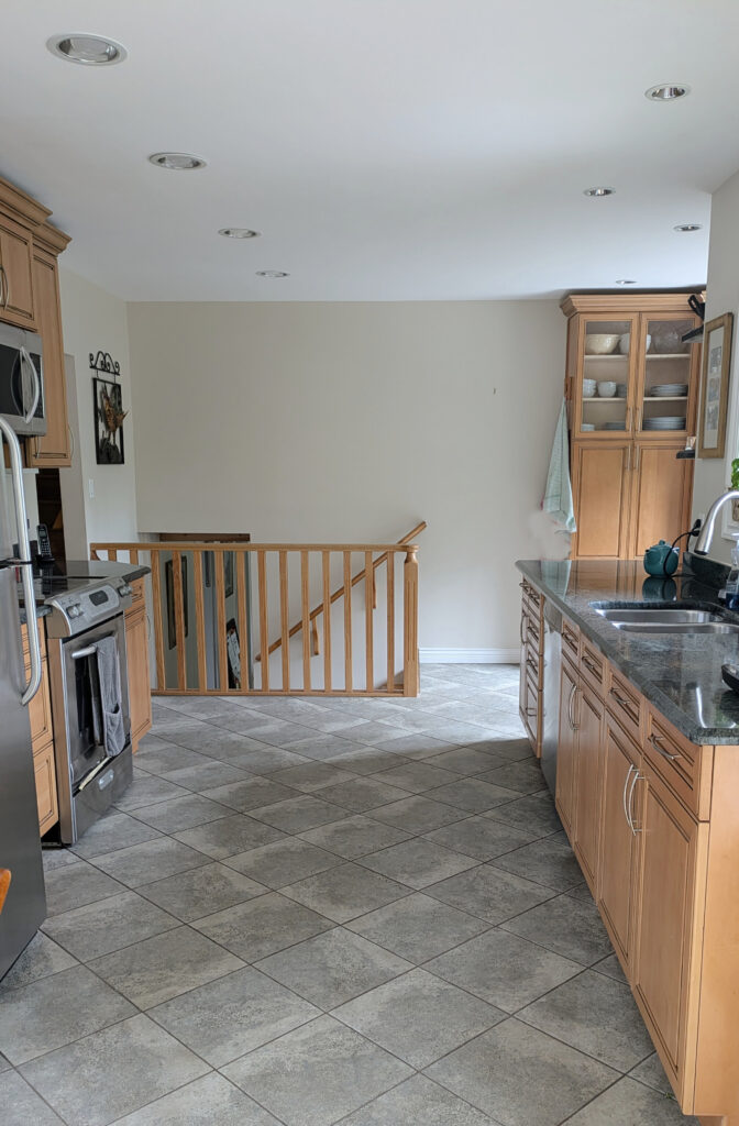 Benjamin Moore Maritime White, best off white beige, beige and green gray tile, maple orange-pink cabinets, green granite countertops, wood railing
