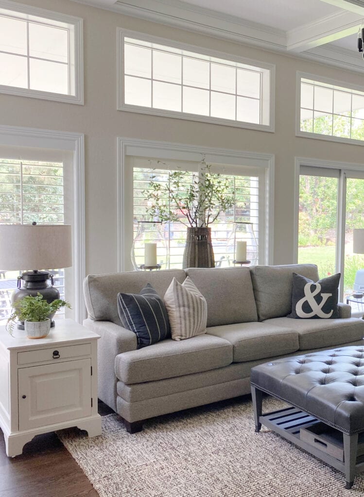 Family room in split level layout, greige furniture, greige walls and White Dove trim. Kylie M Interiors Edesign, diy decorating and design blogger, consultant