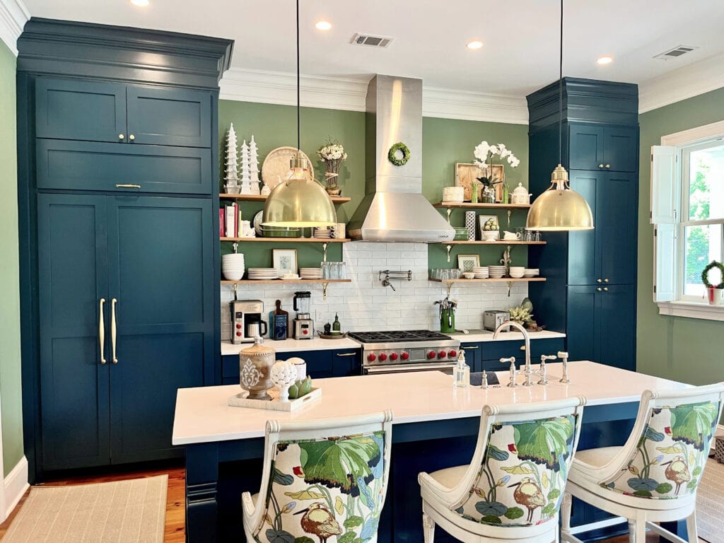 Farrow and Ball Hague Blue painted kitchen cabinets, Calke Green walls, white subway tile, white quartz, gold hardware, floating wood shelves, traditional kitchen, crown molding