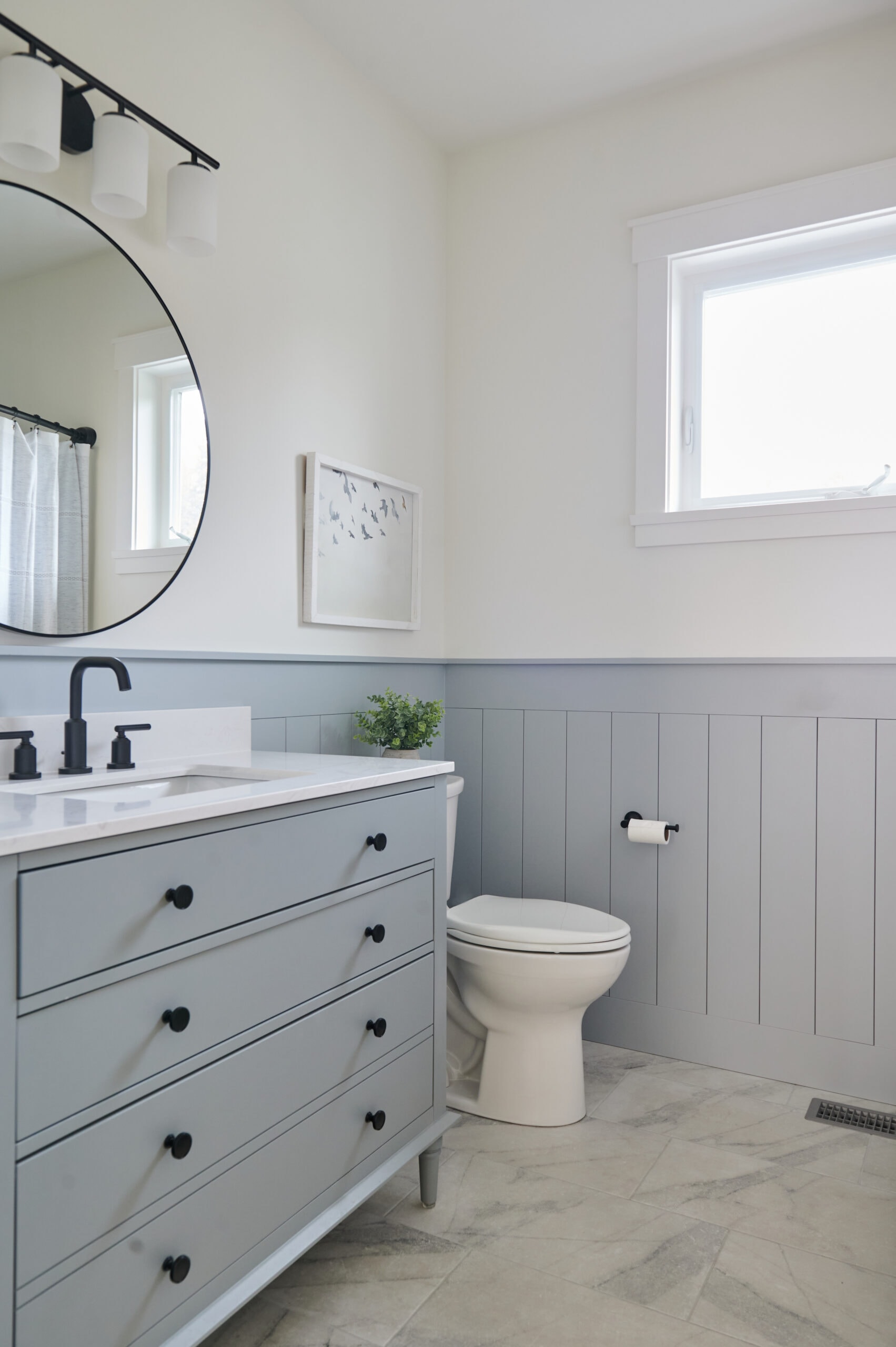 Guest bathroom, shiplap Sherwin Williams Network Gray, upper walls, trims, ceiling, Benjamin Moore White Dove, blue gray vanity, marble look tile floor, round mirror, quartz countertop