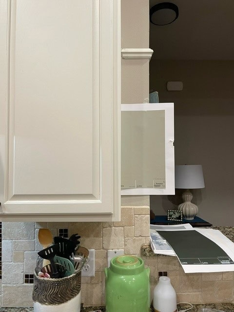 Sherwin Williams Jogging Path, greige paint color with Dover White painted cream wood cabinets, travertine tile backsplash and granite counter