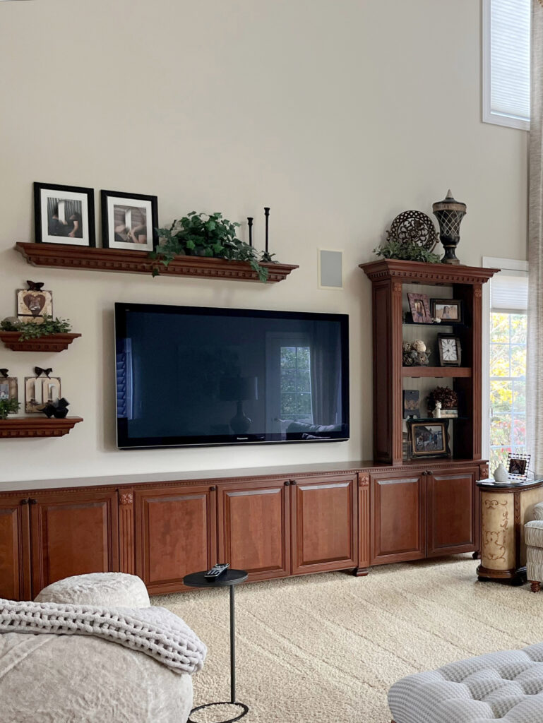Sherwin Williams Natural Linen, great room, living room vaulted ceiling, stone fireplace, cherry wood maple built ins with tv, beige carpet and drapes, Extra White trim (2)