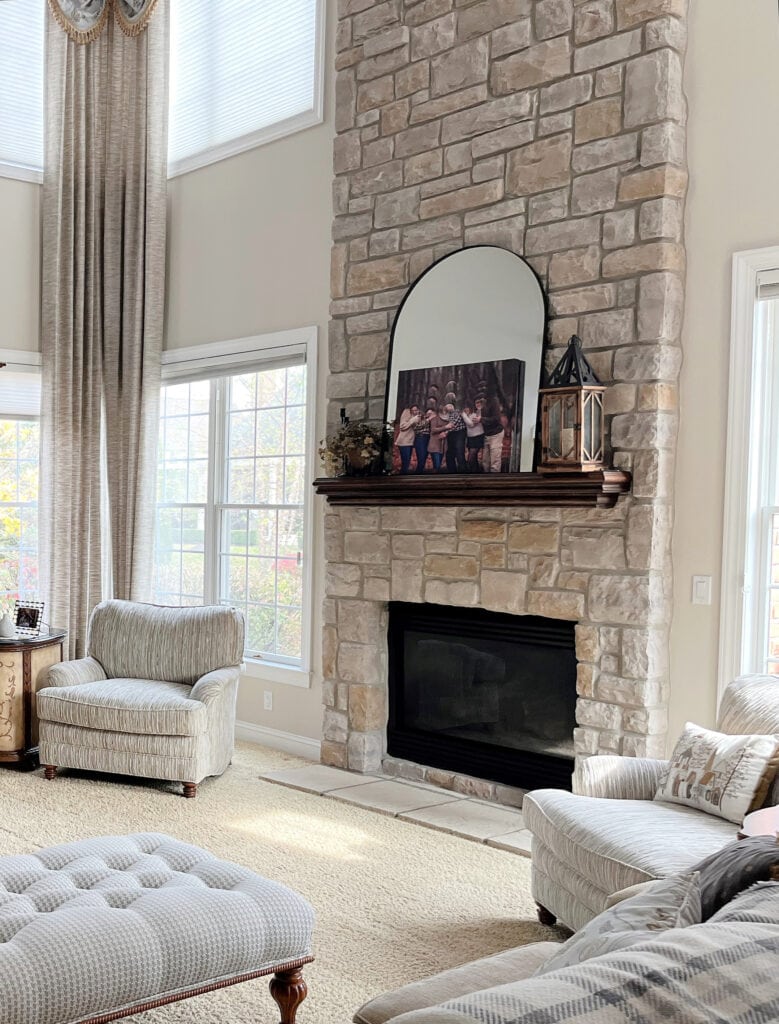 Sherwin Williams Natural Linen, great room, living room vaulted ceiling, stone fireplace, cherry wood maple built ins with tv, beige carpet and drapes, Extra White trim