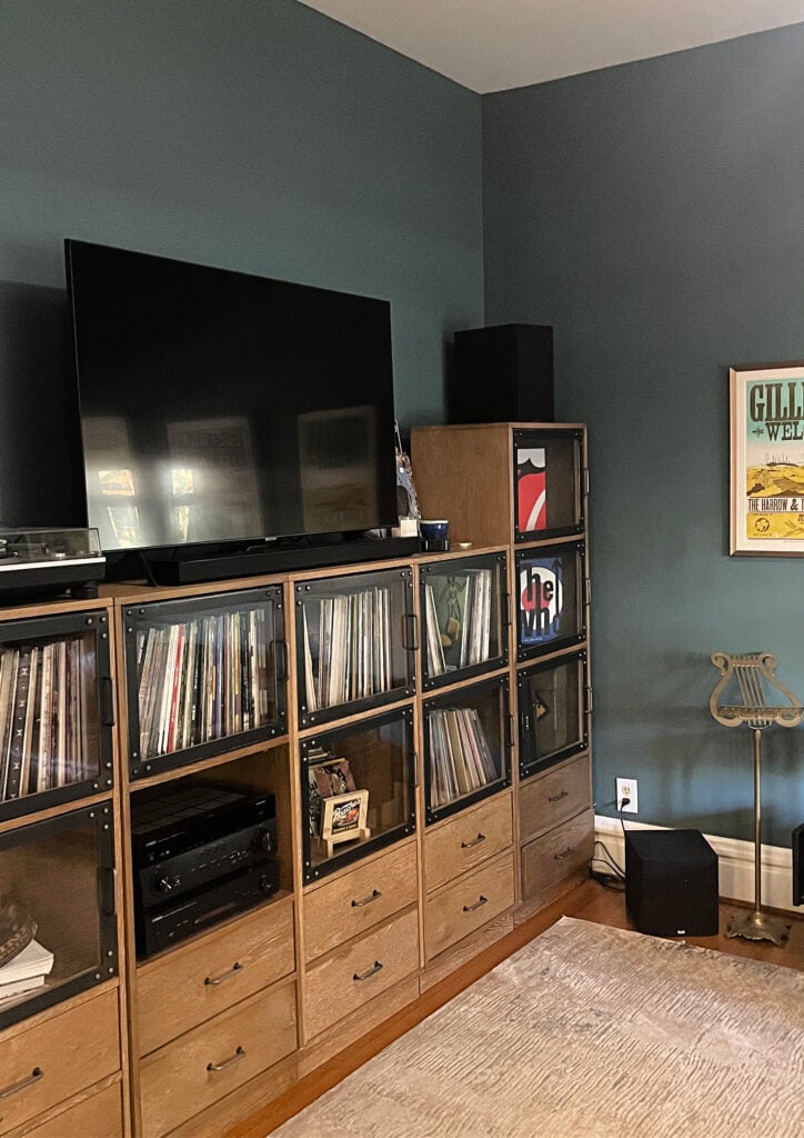 Sherwin Williams Riverway in music lover den with record storage, best blue green paint color