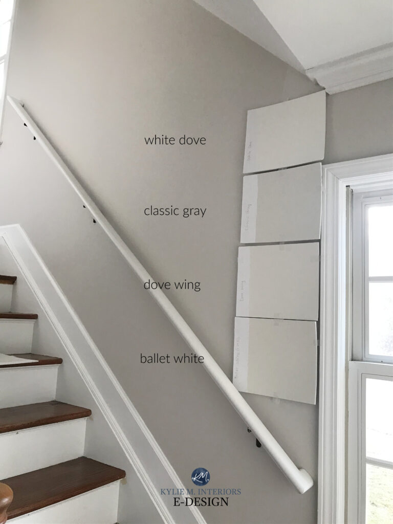 Benjamin Moore Ballet White, Dove Wing, Classic Gray, White Dove. samples in hallway against white trim