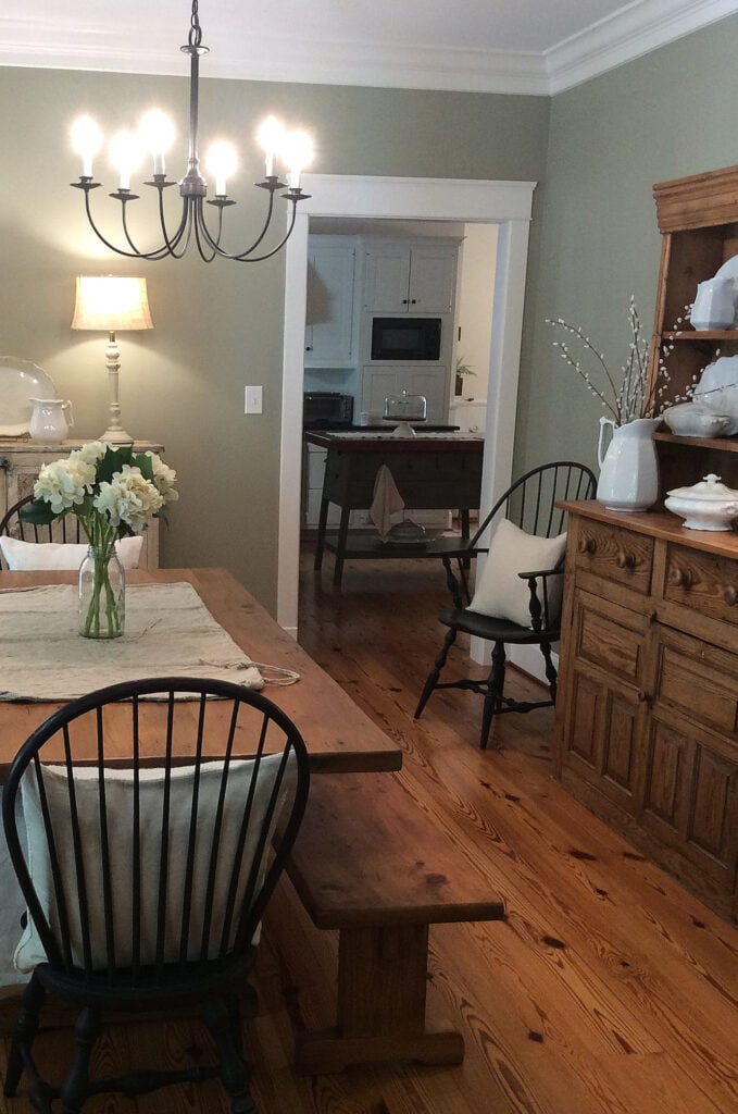 Benjamin Moore Nantucket Gray, green-gray paint color with pine wood floor, farmhouse dining room with Cloud White trim