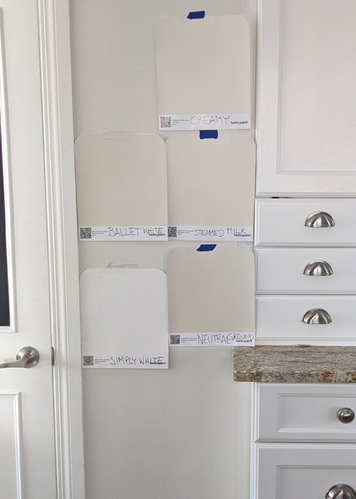 Benjamin Moore ballet white, Sherwin Williams steamed milk, creamy, neutral ground samples on wall