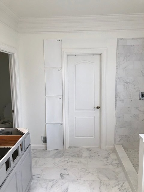 Best white paint colors, Benjamin Moore Decorators White, Chantilly Lace, Super White, Sherwin Williams High Reflective White with marble tile in bathroom