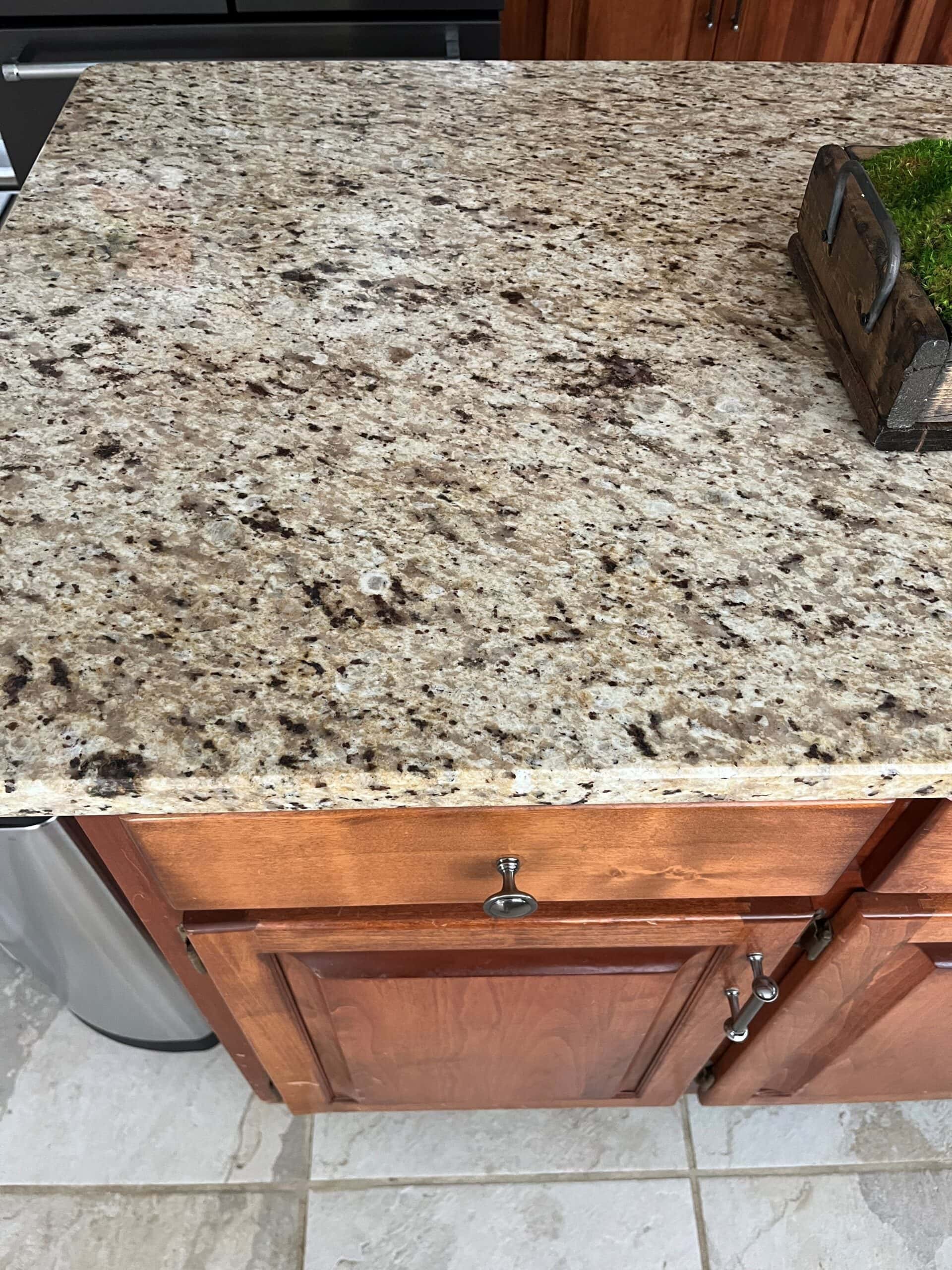 Santa Cecilia granite countertop, similar to Giallo Ornamental, common in Mediterranean or tuscan style homes in 2000s and 1990