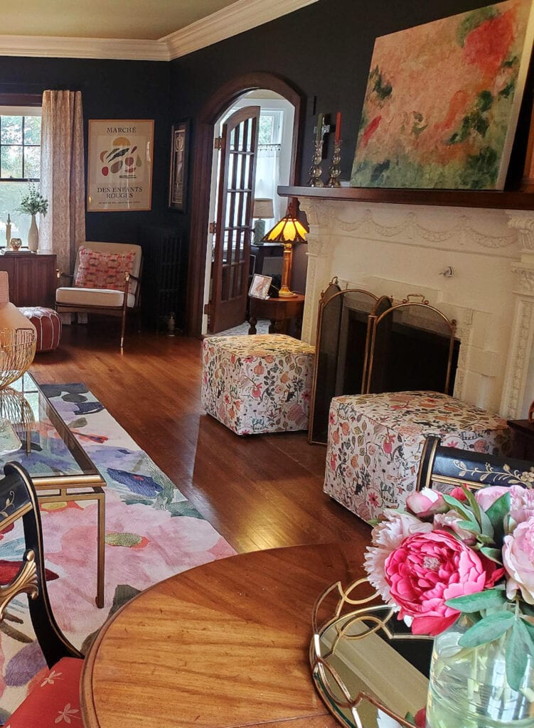 Sherwin Williams Black Swan, dark purple paint color, heritage old fireplace surround, wood floor, eclectic colors with pink accents