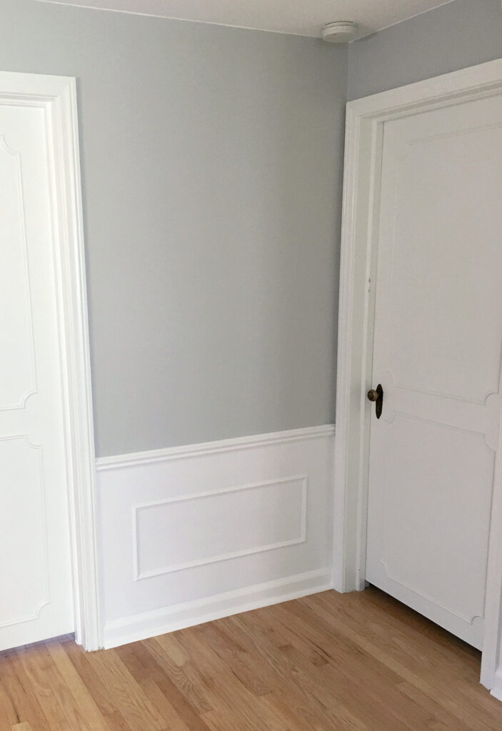 Silverplate Sherwin Williams with white wainscoting and doors. White oak flooring. Kylie M INteriors E-design and Online Colour Consulting services