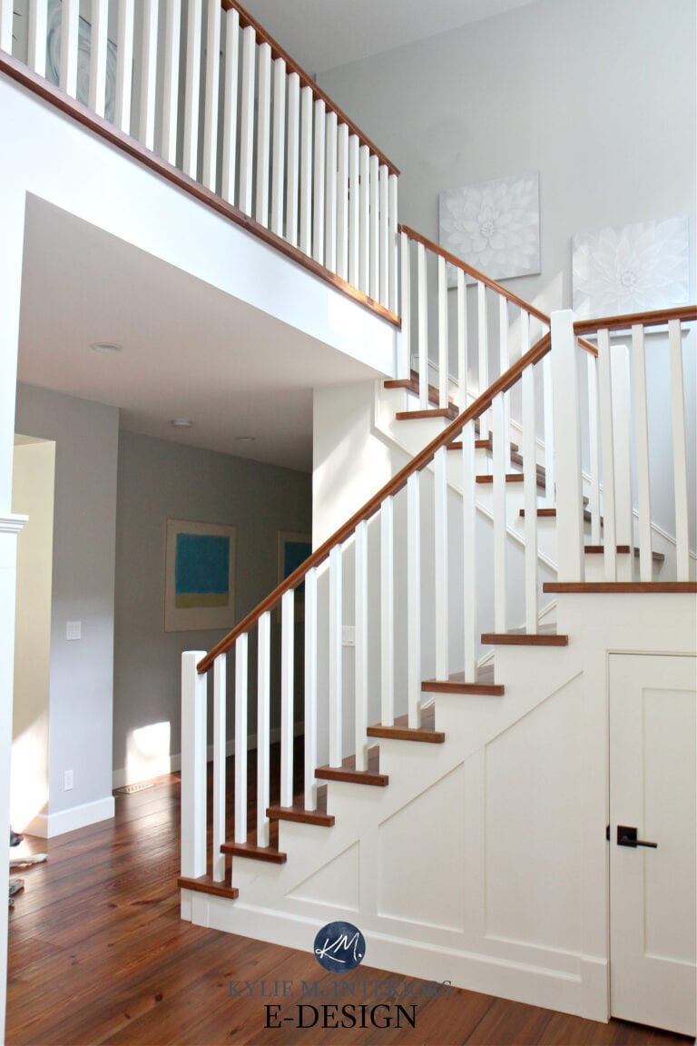 Staircase, white spindles, wood treads and stair raillings. Benjamin Moore Cloud White and Gray Owl. Kylie M Interiors paint color expert and blogger. Reclaimed pine wood flooring
