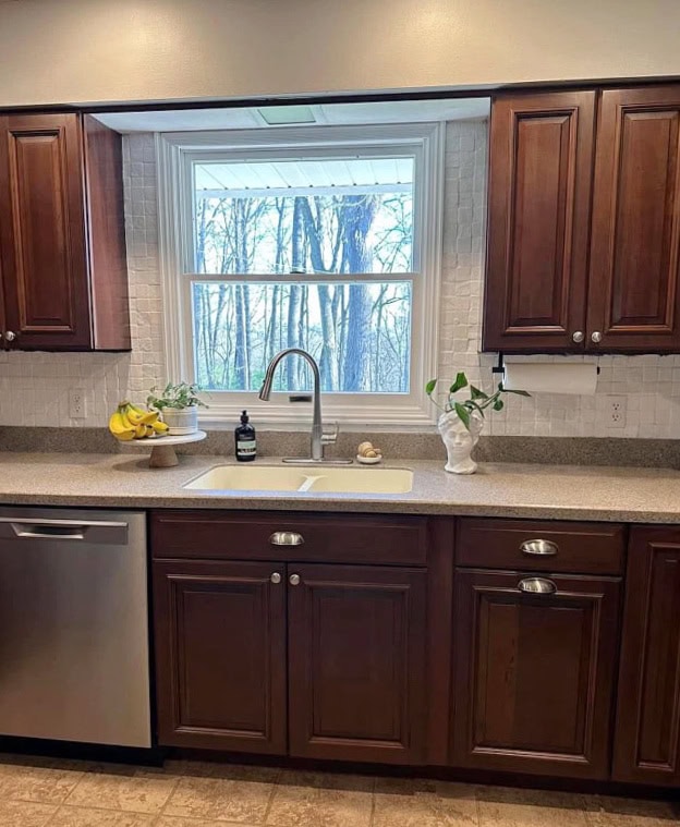 before update kitchen with dark red stained cherry or maple wood cabinets, gray taupe corian countertops, painted tile backsplash
