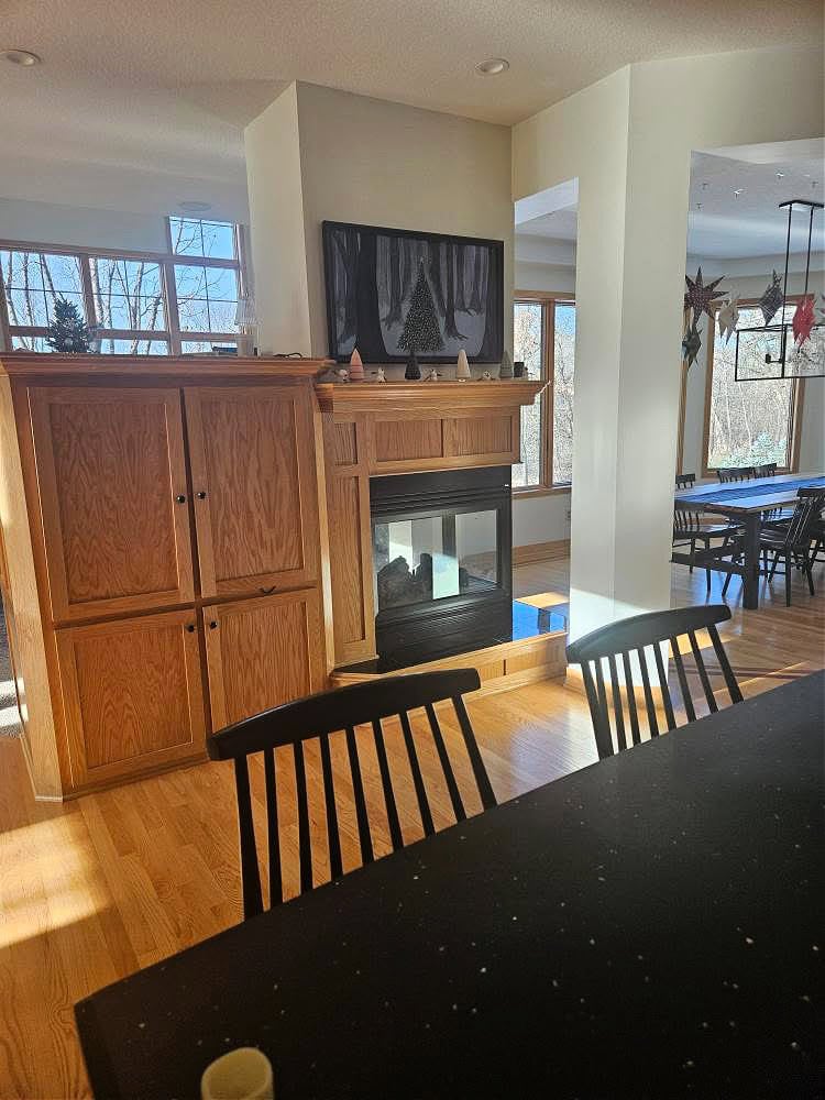 oak built in tv cabinet with corner fireplace and oak floor, golden
