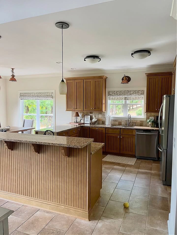 possibly maple kitchen wood cabinets and island with beadboard inserts and back of island, granite countertop like Santa Cecilia, travertine look tile floor, travertine backsplash