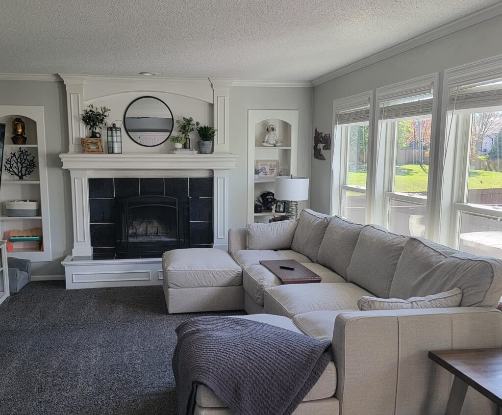 BEFORE fireplace wall in living room with builtins