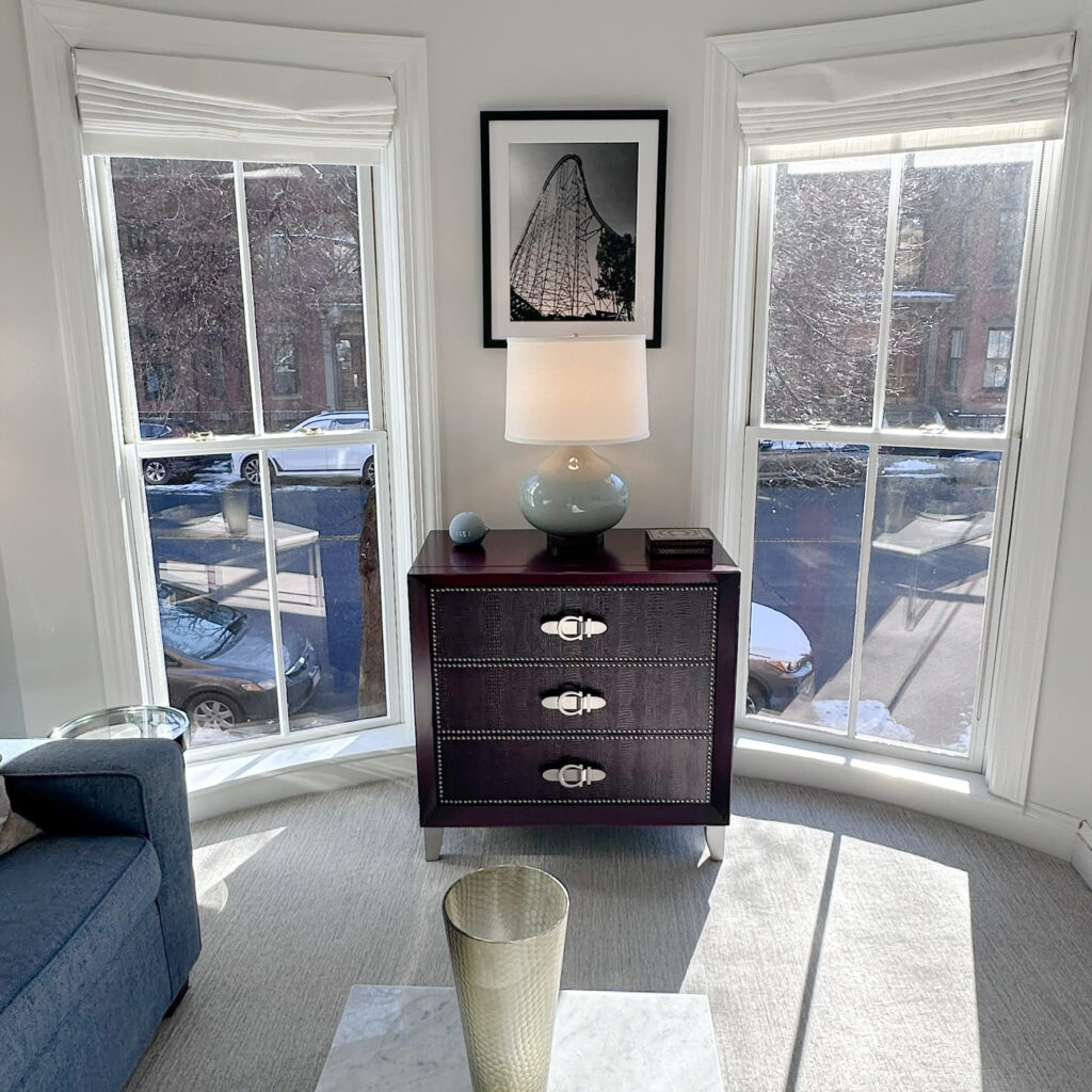 Benjamin Moore Paper White with White OC 151 trim, gray carpet, blue sofa, home decor, south facing light