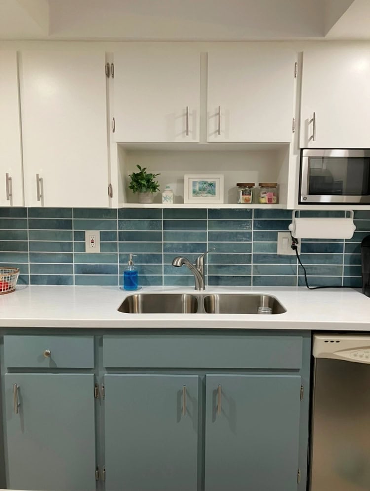 Benjamin Moore Waters Edge painted lower kitchen wood cabinets, Simply White upper cabinets with blue subway tile backsplash and white countertop, SMALL KITCHEN