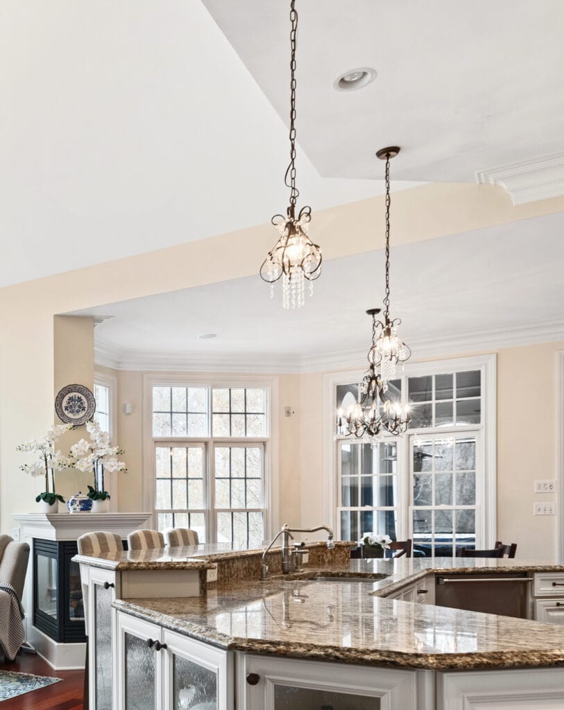 Granite countertop with Sherwin Williams Casa Blanca cream paint color on walls