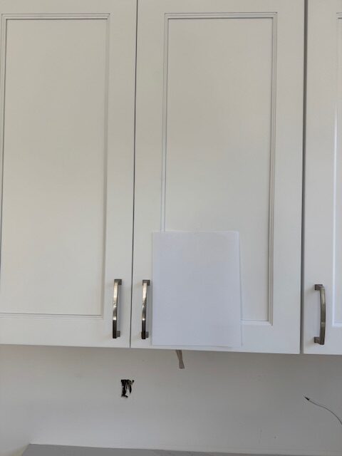 Kraftmaid Frost (white) kitchen cabinets compared to the cool white of paper