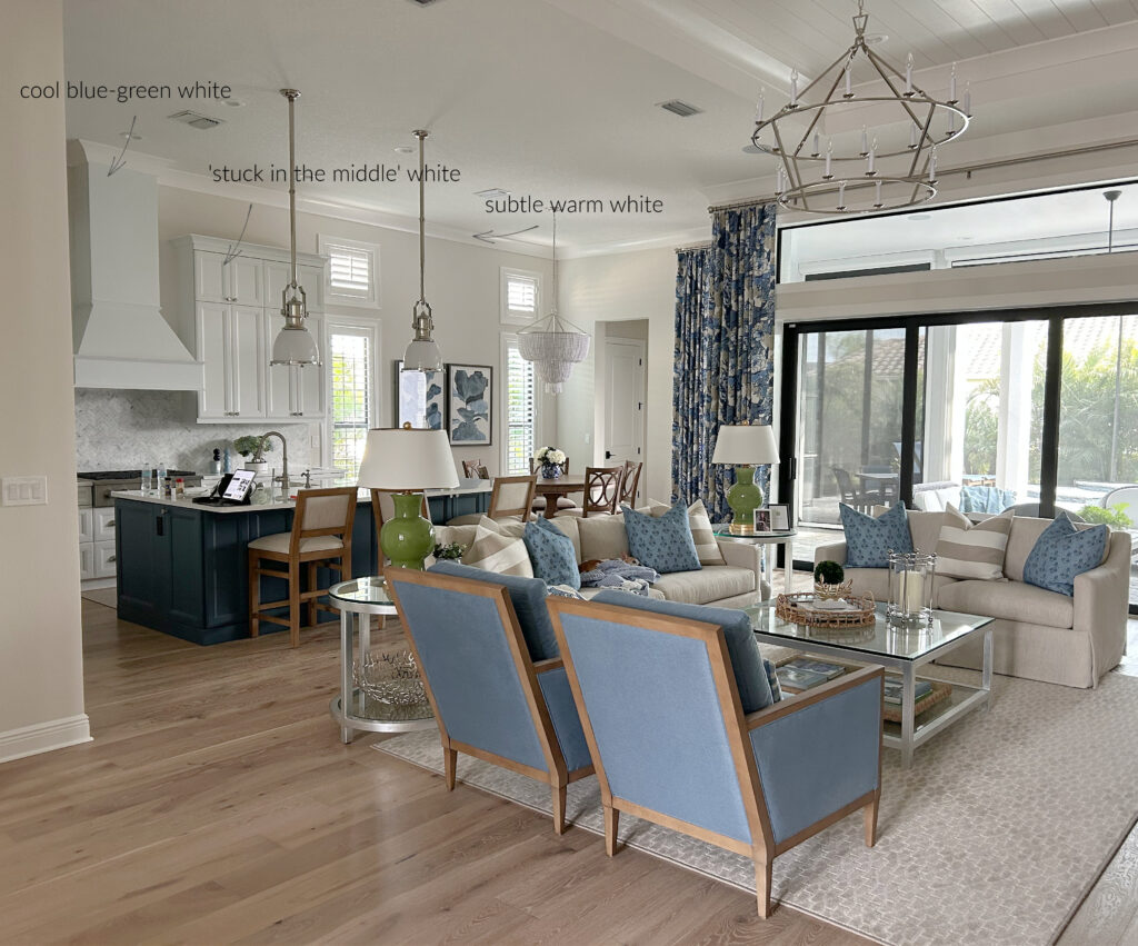 Matching white paint colors, trims, cabinets, Delicate White trim PPG Paraffin walls, blue accent chairs, open concept home, traditional and transitional, drapes, high ceiling