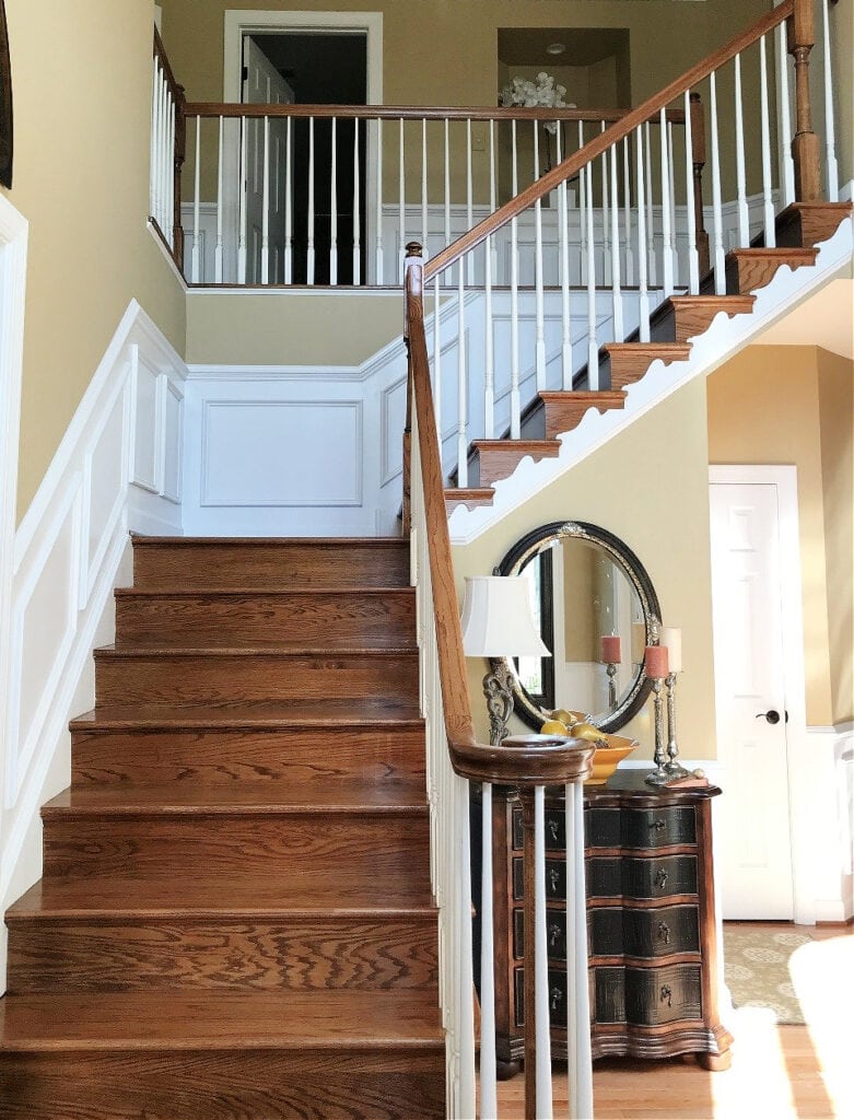 Shelburne Buff beige gold paint color with oak stairs, white hand railings, traditional 1990 staircase, Super White trim (1)