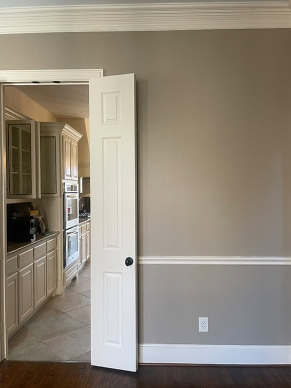 Sherwin Williams Casa Blanca cream painted trim and doors with Stone Lion beige walls