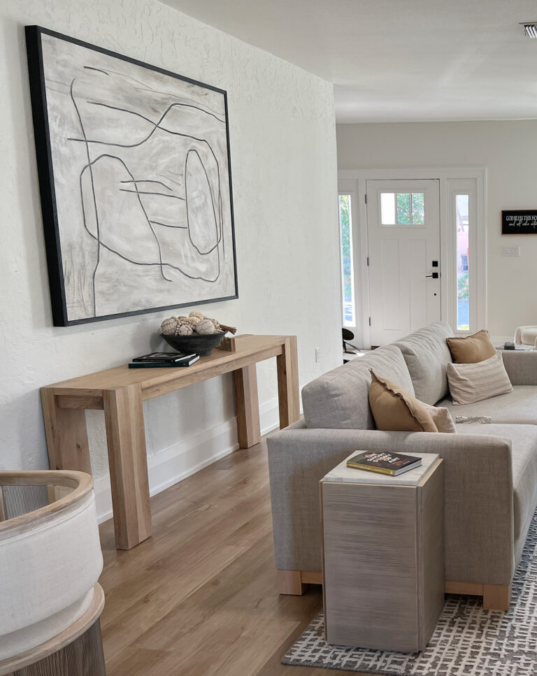 Sherwin Williams Greek Villa 25% lighter, Extra White trim, neutral beige cream furniture, light warm woods, south facing, console table, oversized large art