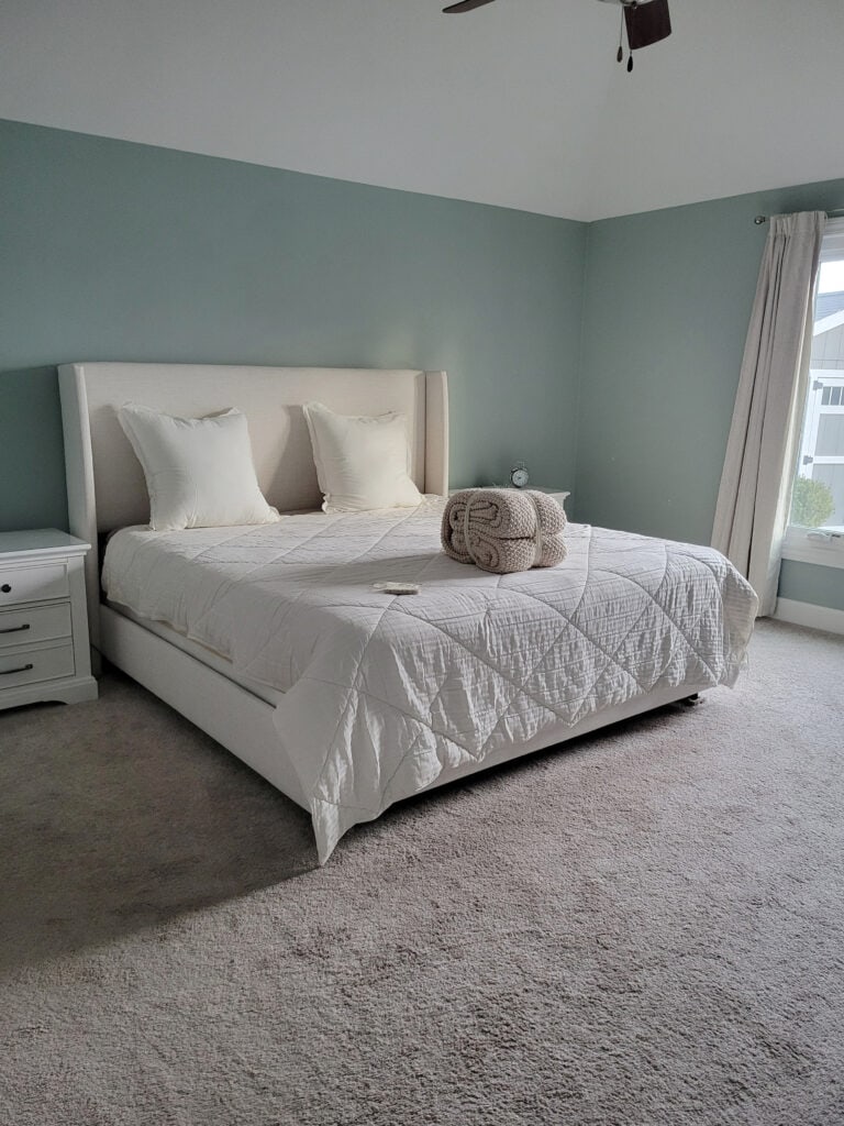 Sherwin Williams Quietude, warm gray taupe carpet, bedroom, upholstered headboard
