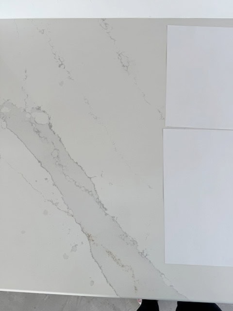 Silestone Et Calacatta Gold white quartz countertop with close-up of veins, gray and warmth
