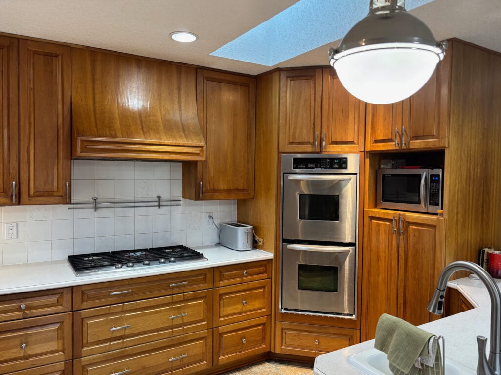 before update ideas, cherry wood orange-red stain kitchen cabiunets, off-white laminate countertop, wall oven