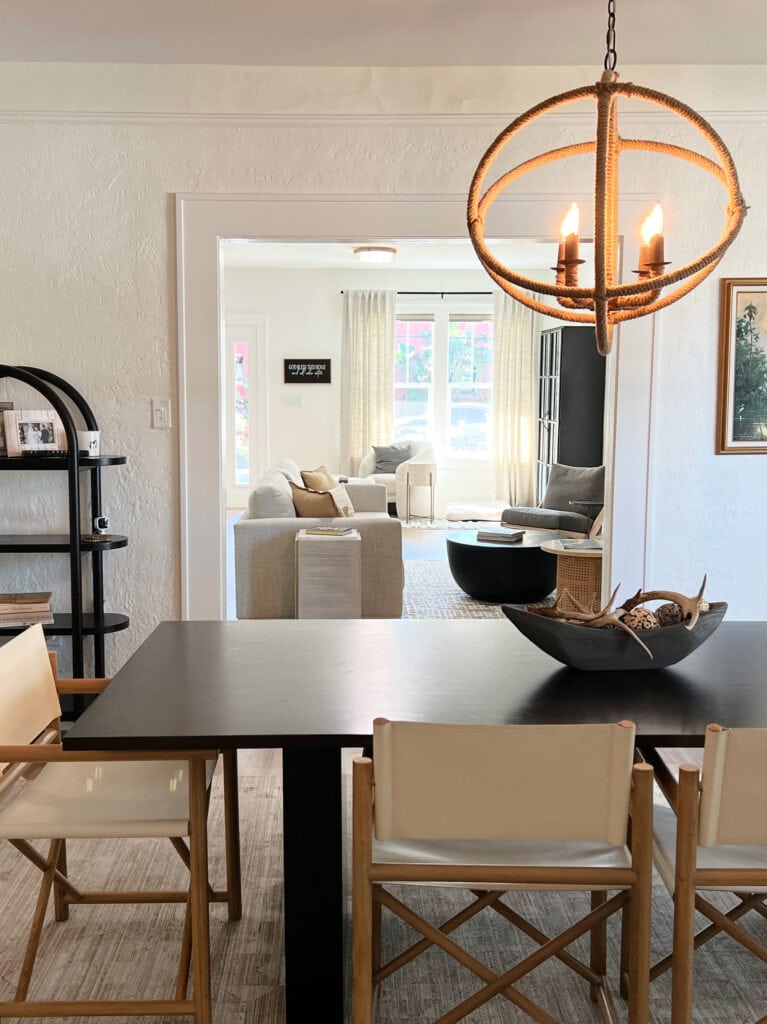 shotgun style home, textured walls, dining room in Sherwin Williams Greek Villa lightened, Extra White trim, livingroom throuh doorway (2)