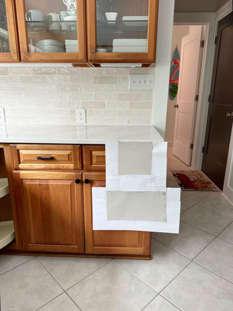 zellige look pink toned subway tile, cherry wood cabinets, taupe beige tile floor, Sherwin Williams Popular Gray, Benjamin Moore Collingwood