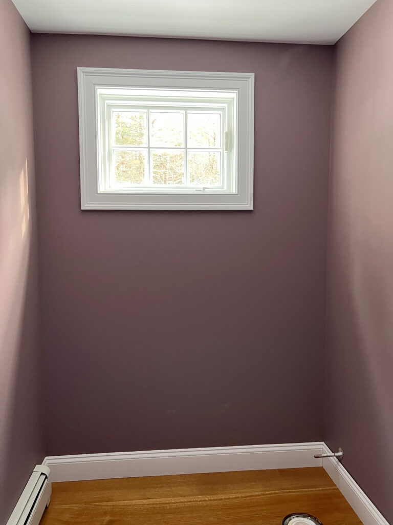 Benjamin Moore Cinnamon Slate purple paint color in small pantry room with wood floor and Pure White trim