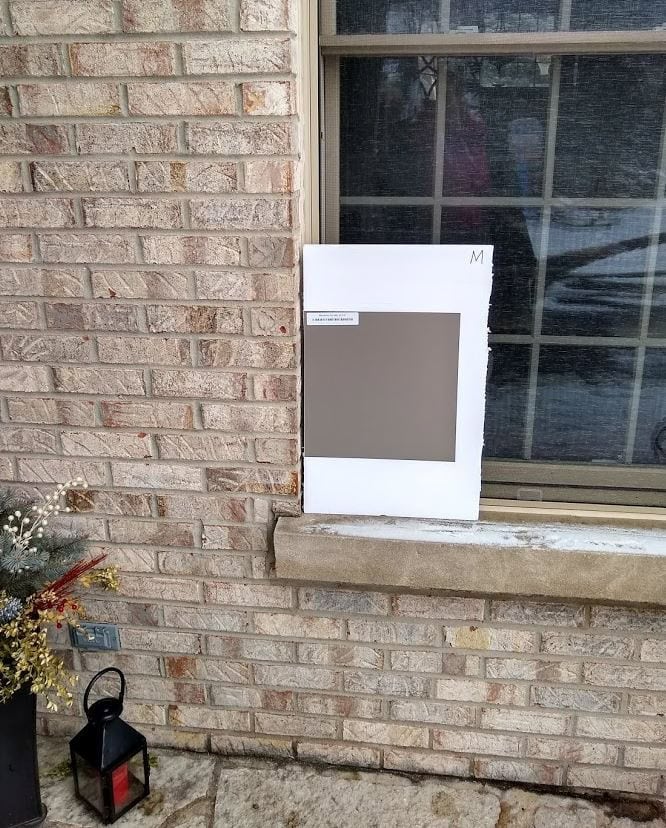 Benjamin Moore Metropolis with warm pinkish brick exterior