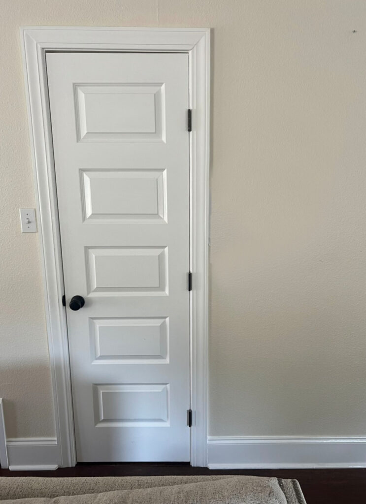 Sherwin Williams Casa Blanca cream paint color with warm white trim and door