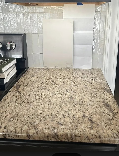 Sherwin Williams Heron Plume with similar to Santa Cecilia granite countertop