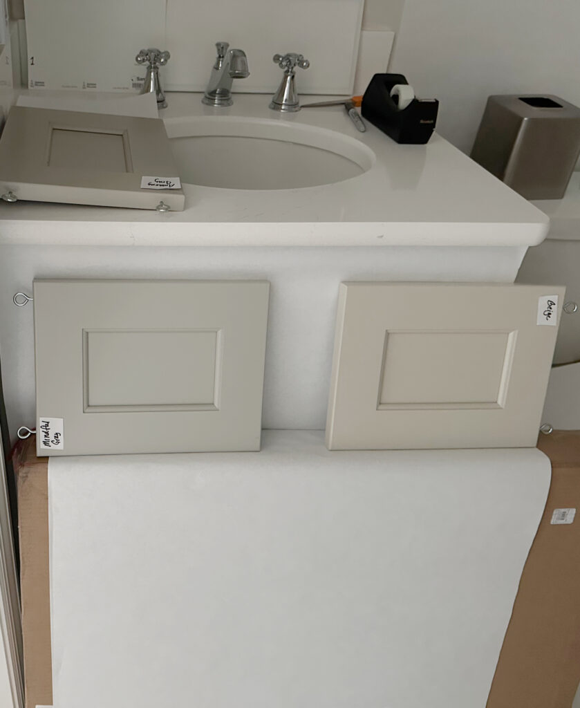 Sherwin Williams Mindful Gray and Accessible Beige cabinet paint color samples with white quartz bathroom countertop