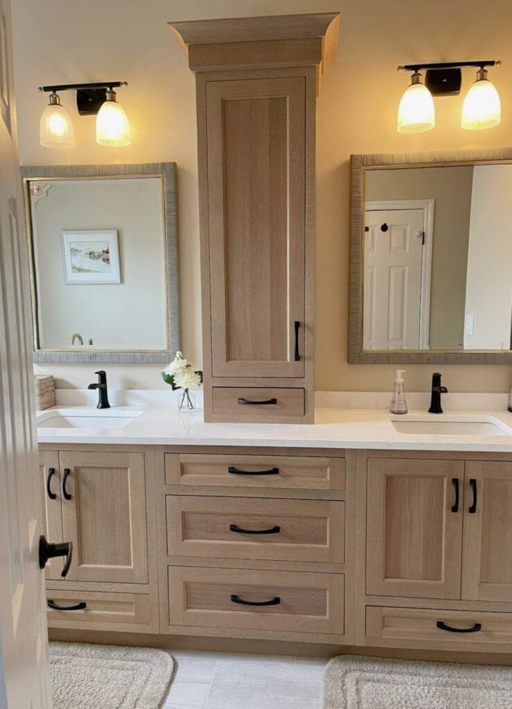 Beige paint color on walls, double vanity in ensuite bathroom, wood cabinets, white quartz, taupe tile floor