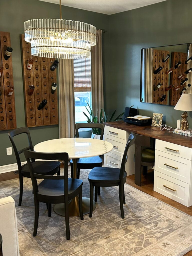 Sherwin Williams Retreat, office den, wall wine rack, marble round table, dark green paint color, Whtie Dove trim, wood oak floor, home decor