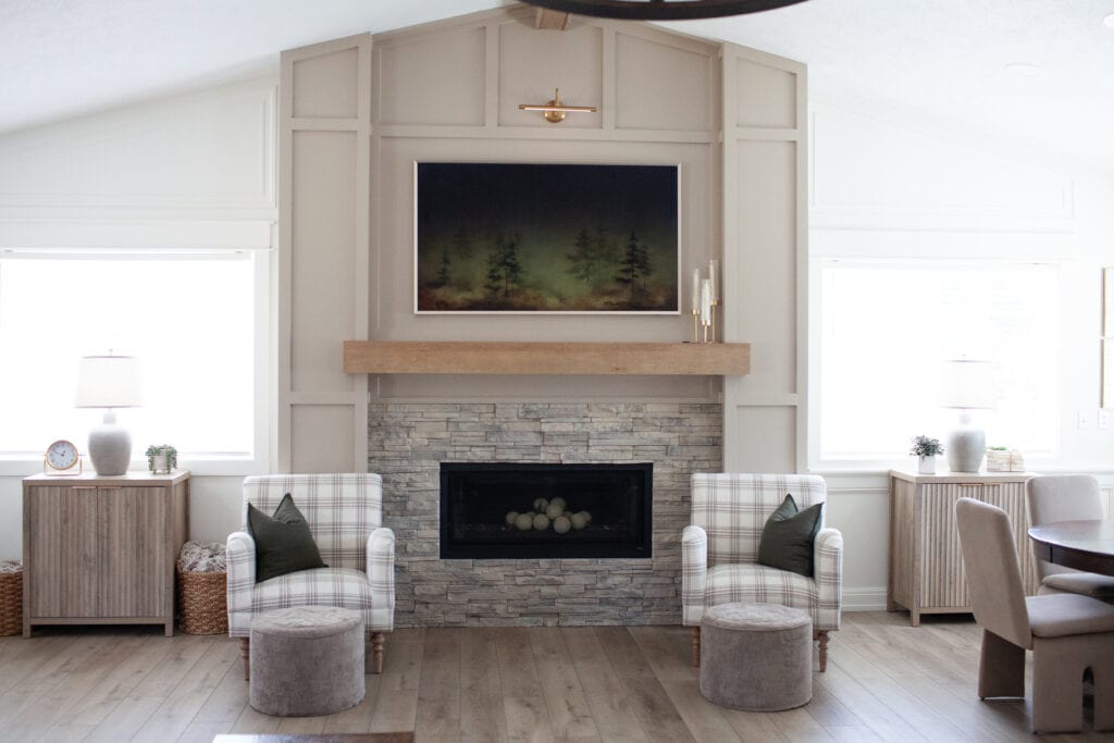 1990s fireplace update, vaulted ceiling, panels, moldings, trims to walls and fireplace surround, stacked stone gray beige. Sherwin Williams Balanced Beige, Cold Foam, graywash floor