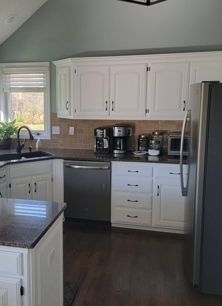 BEFORE, kitchen painted wood cabinets, hinges, wood floor, granite countertop, TRAVERTINE TILE BACKSPLASH