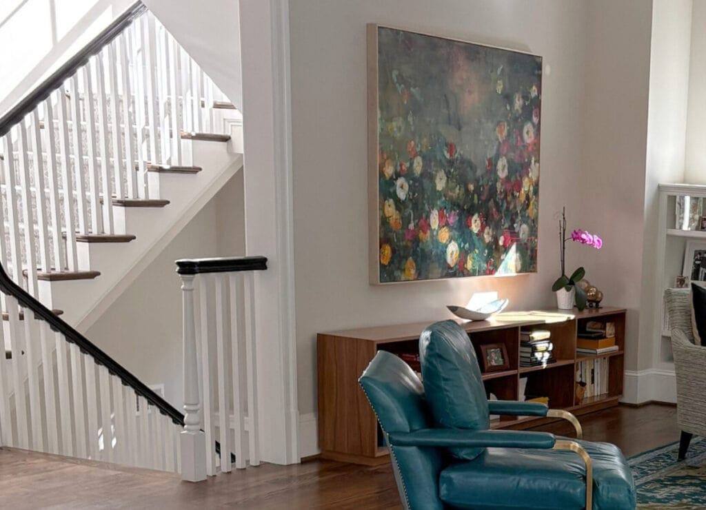 Benjamin Moore Edgecomb Gray in living room and staircase with white trim and dark wood flooring
