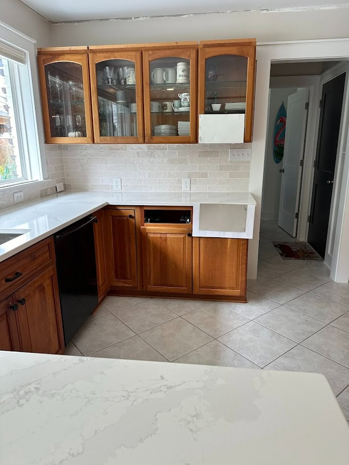 Cherry wood kitchen cabinets, red stain, Silestone Et Calacatta Gold white quartz countertop, warm gray taupe floor tile, Zellige backsplash tile similar to Bedrosian Cloe