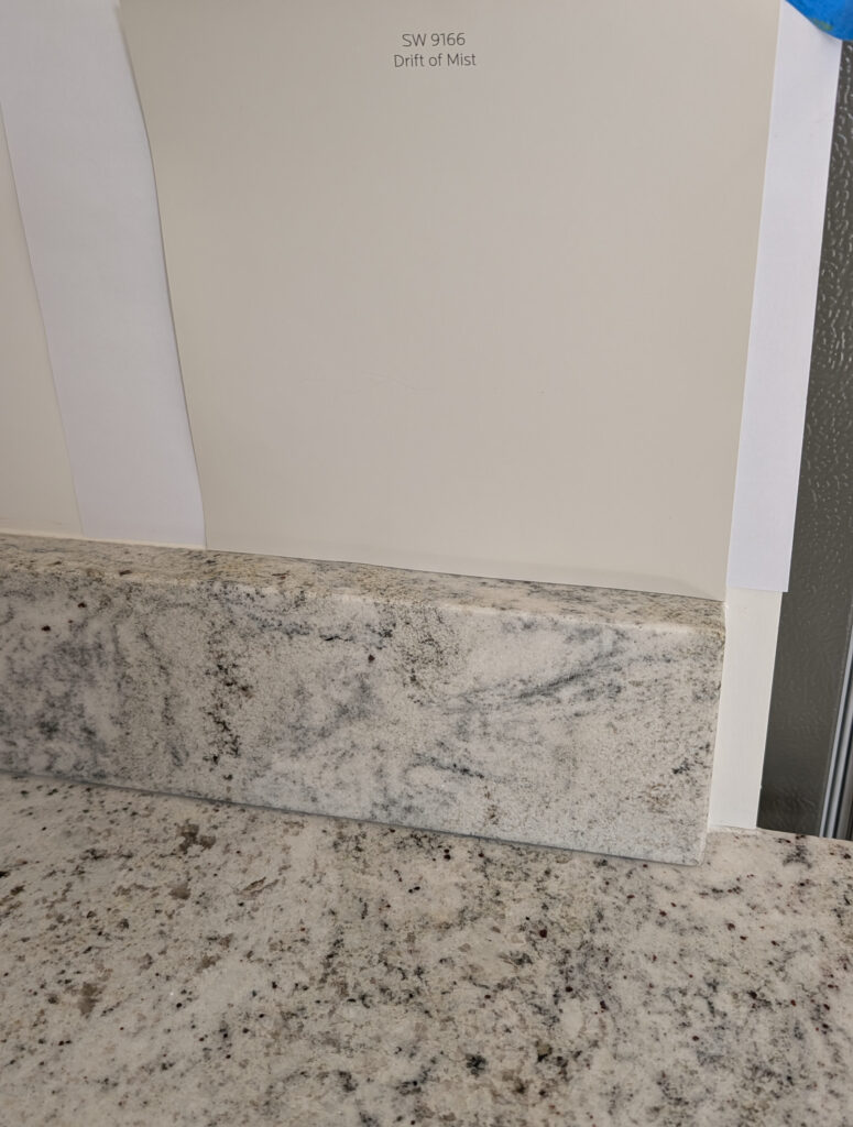 Drift of Mist with light grayish neutral speckled granite countertop in kitchen