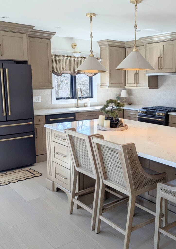 Oak wood custom stained cabinets, whitewash wood floor, white quartz countertop, Vicostone Misterio Gold, GE matte black appliances, brushed brass hardware, wood island, black window
